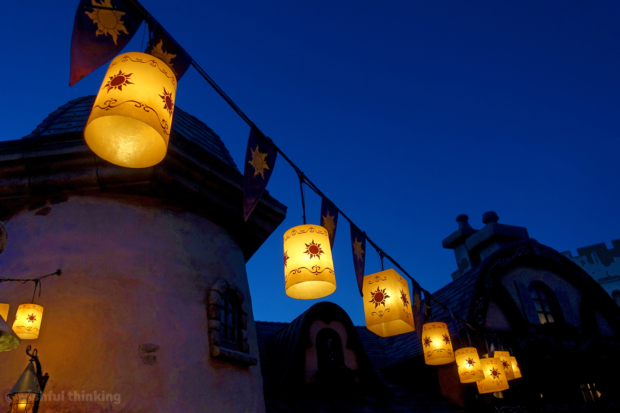 Rapunzel's lanterns illuminate a path within the Magic Kingdom theme park at Walt Disney World in Orlando, Florida