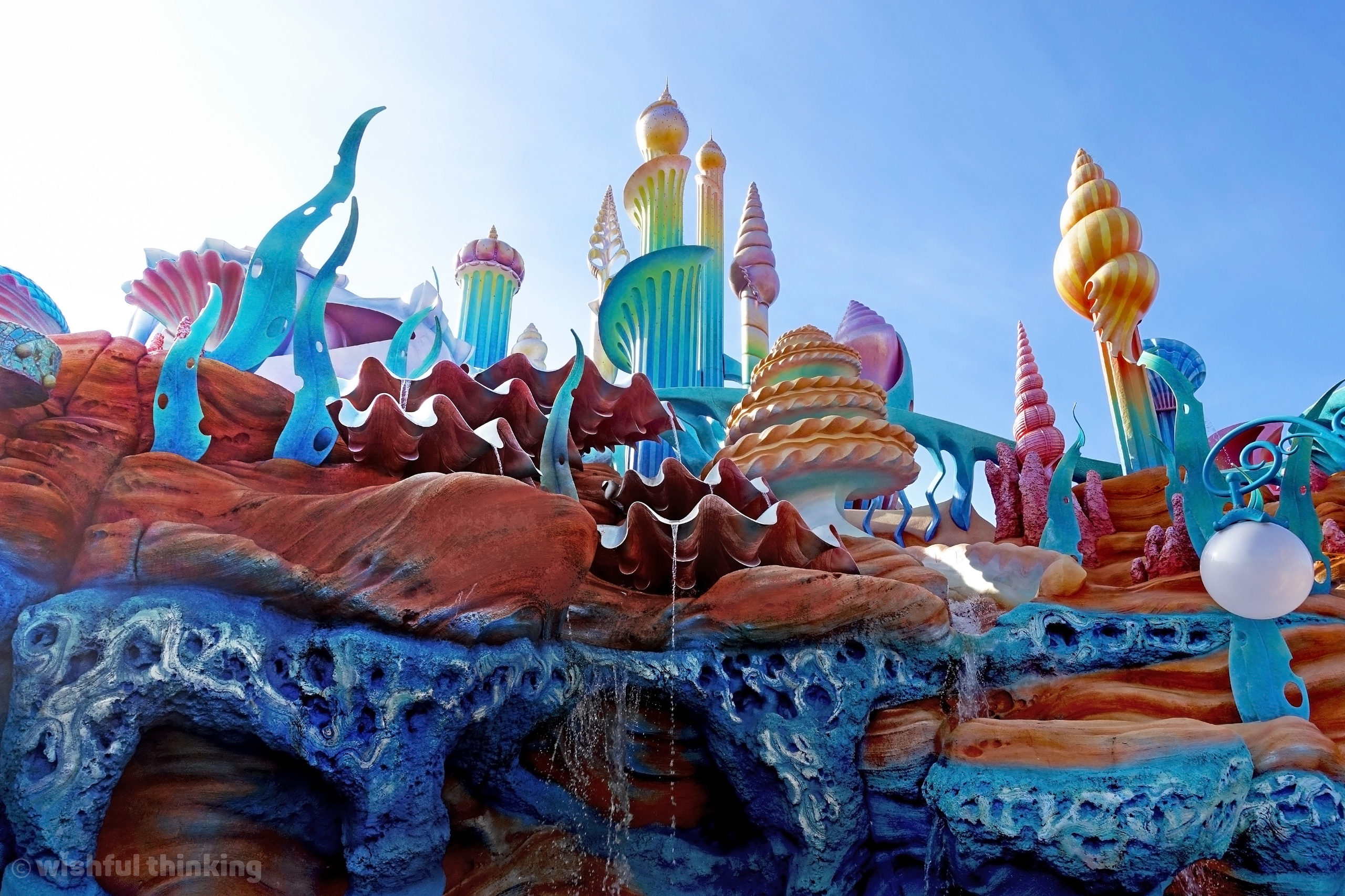 Ariel herself couldn't have had it better down where it's wetter! Coral spires and cascading waterfalls of Mermaid Lagoon at Tokyo Disney Sea in Japan