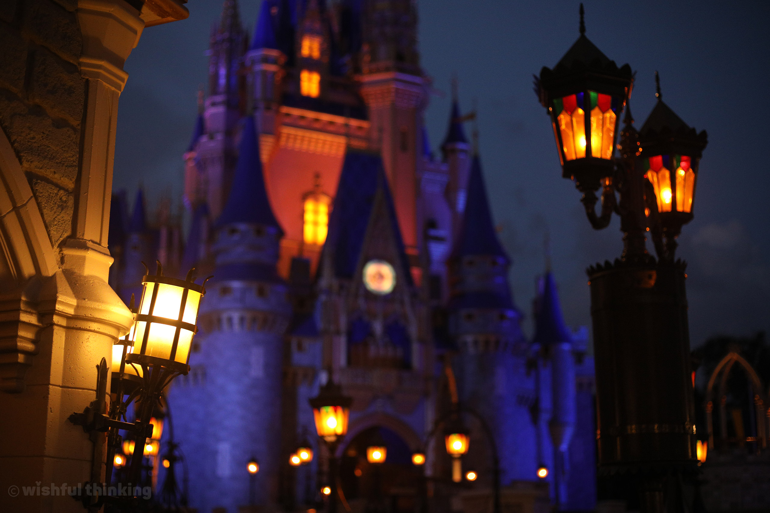 A nighttime glow of Cinderella Castle at the Walt Disney World Magic Kingdom theme park in Orlando, Florida