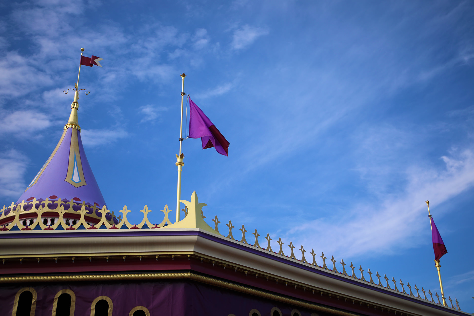 A flag waves atop the carousel in Fantasyland at Disney's Magic Kingdom