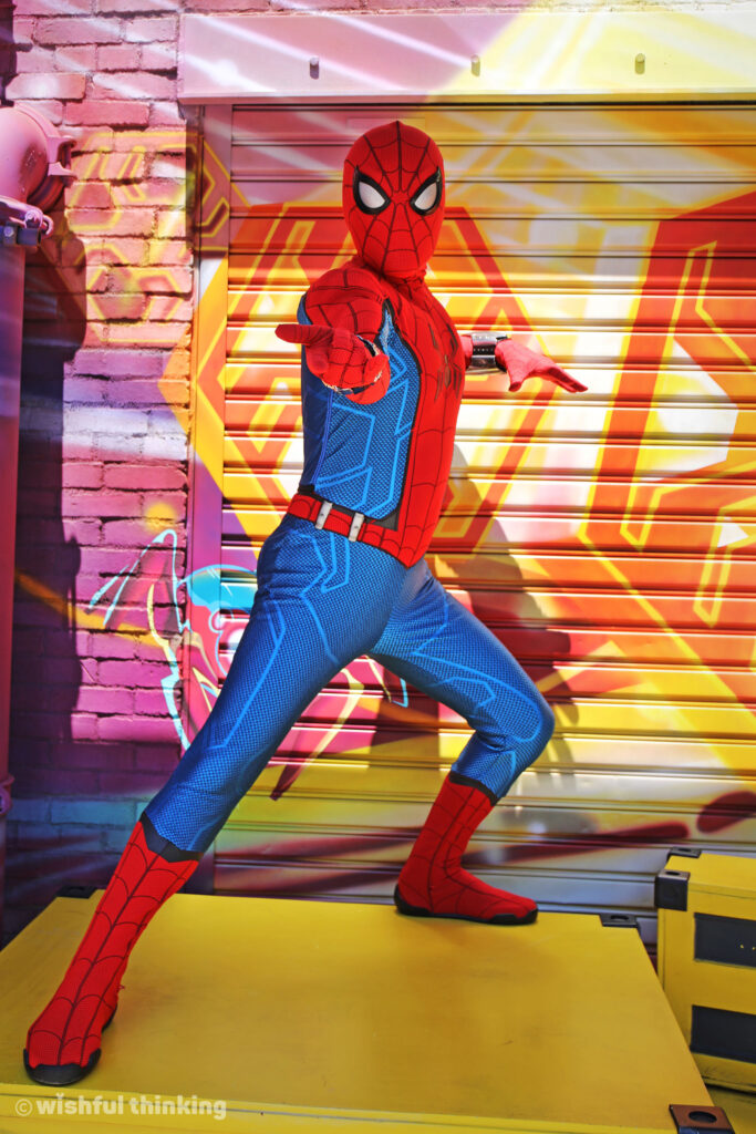 Spider-Man shows off his web-slinging skills outside WEB SLINGERS A Spider-Man Adventure at Disney's Avengers Campus