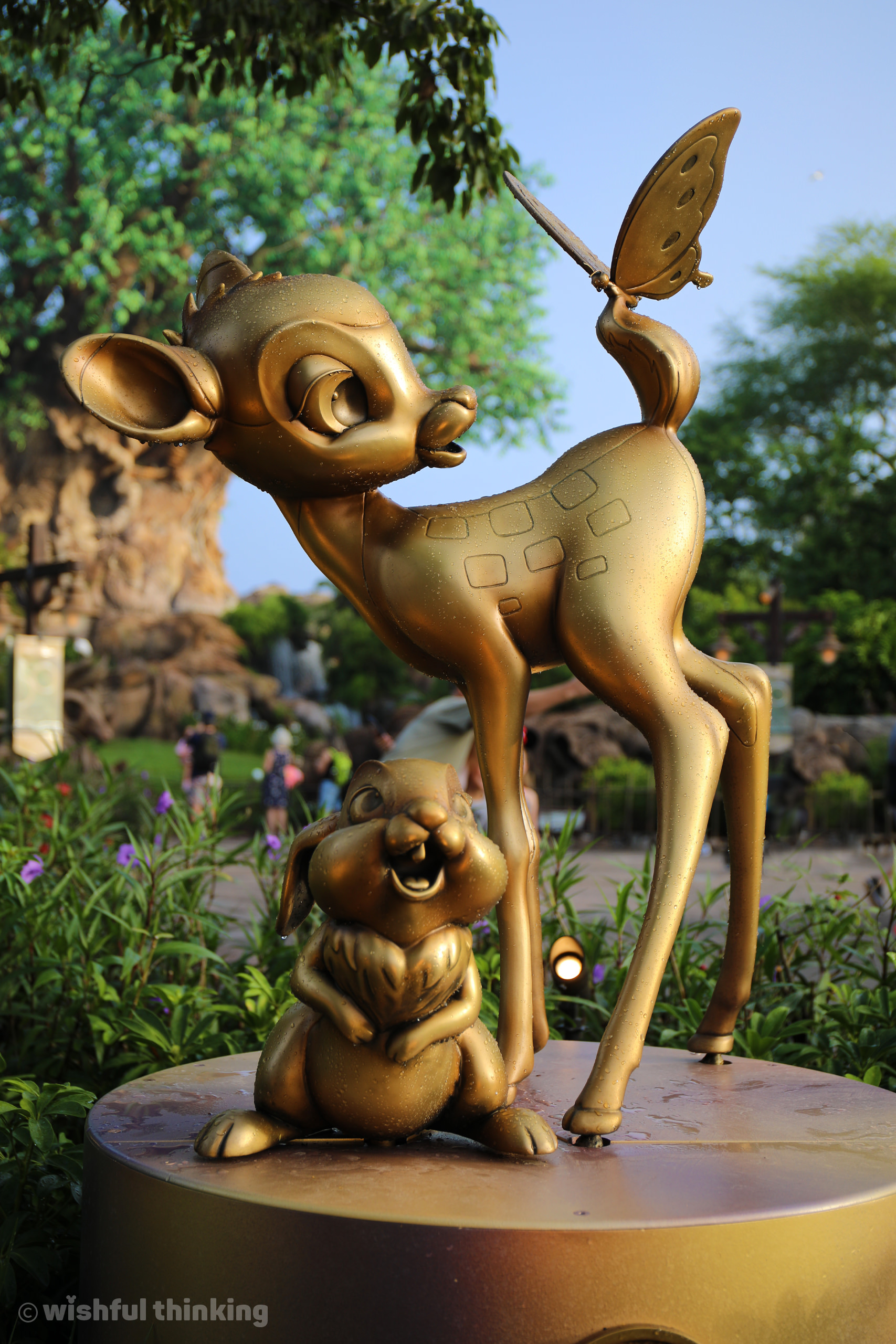 A golden statue of Bambi and Thumper greet guests at Disney's Animal Kingdom for the 50th Anniversary celebration Fab 50