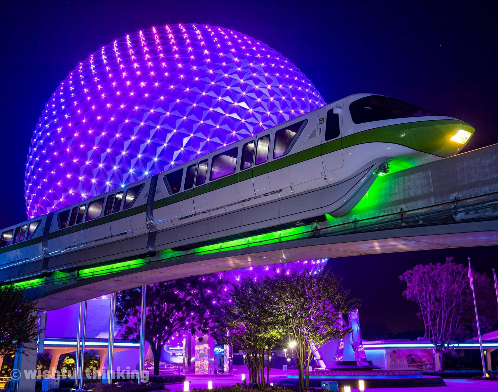 EPCOT's monorail glides in front of an illuminated Spaceship Earth during the 50th Anniversary celebration at Walt Disney World in Orlando, Florida