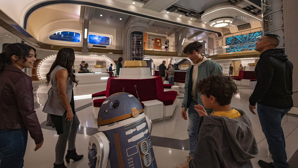 A SK-62O droid welcomes guests in the Atrium of the Star Wars Galactic Starcruiser in Lake Buena Vista, Florida
