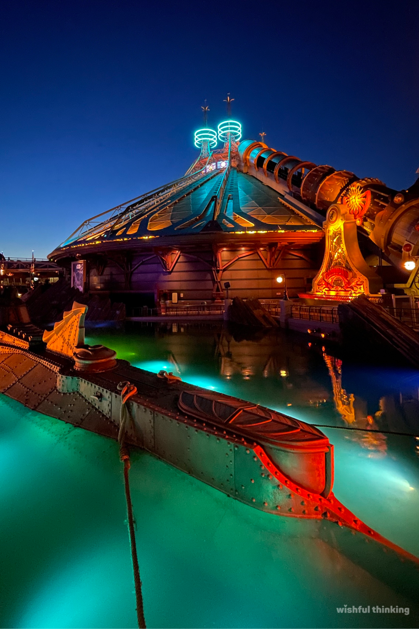 The gorgeous night of Disneyland Paris's Discoveryland illuminates the Nautilus submarine and Space Mountain