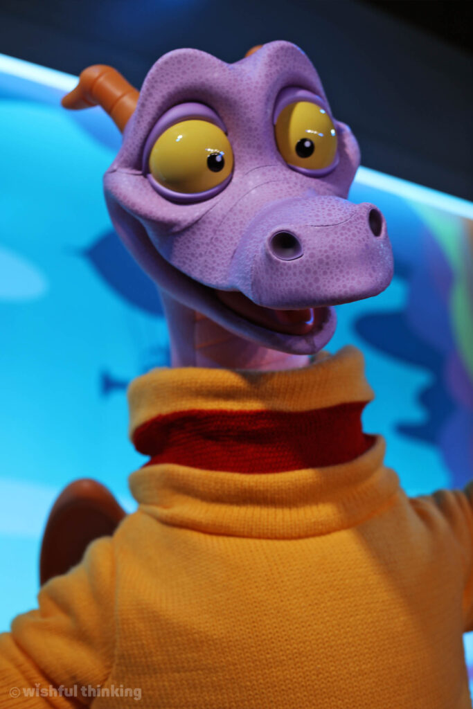 Figment, the adorable purple dragon from EPCOT's Journey Into Imagination Pavilion, smiles for guests at Walt Disney World in Orlando, Florida