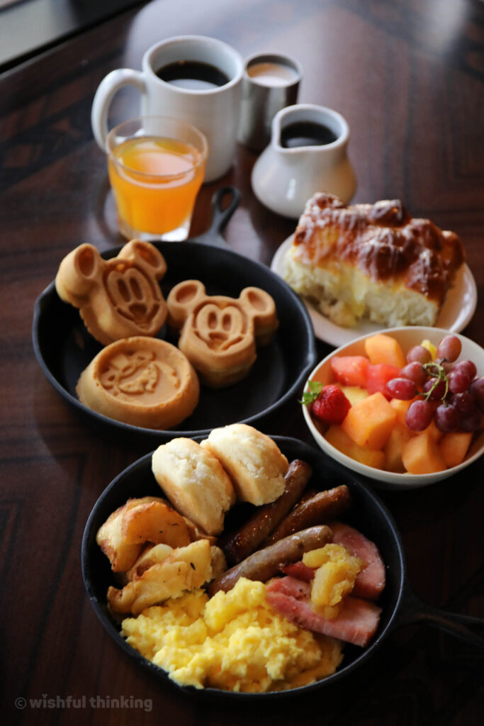 Mickey Waffles, eggs, sausage, fresh fruits, and pull-apart bread delights guests at 'Ohana restaurant at Disney Polynesian Village Resort