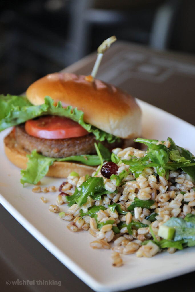 A plant-based burger with farro salad at ABC Commissary at Disney's Hollywood Studios