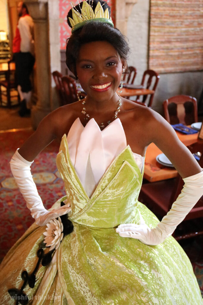 Princess Tiana smiles for guests who dine at Walt Disney World's Akershus Royal Banquet Hall in the Norway Pavilion at EPCOT