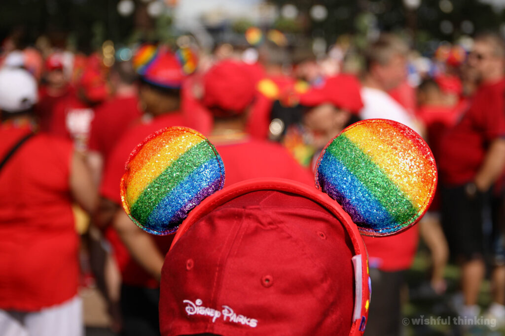 A headband sporting rainbow-hued mouse ears atop a Magic Kingdom guest at Walt Disney World during the annual Gay Days celebration
