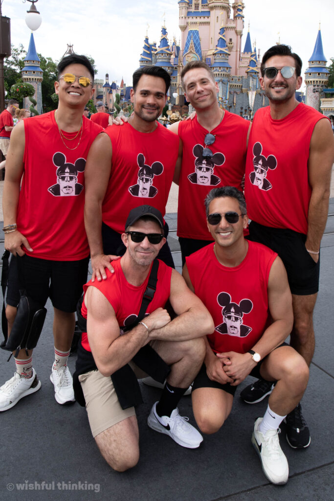 A group of young men pose in red t-shirts during Gay Days at Magic Kingdom Park in Walt Disney World, Orlando, Florida